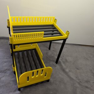 Modern 1:12 scale 3D printed stackable bunk beds for dollhouses in bright yellow with black frames and slatted bases.