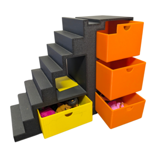 Modern 3D printed dollhouse staircase in grey with yellow and orange pull-out storage drawers for miniature accessories.